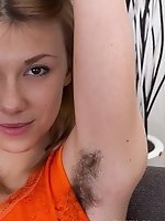 Alisia puts on sexy striptease on sofa